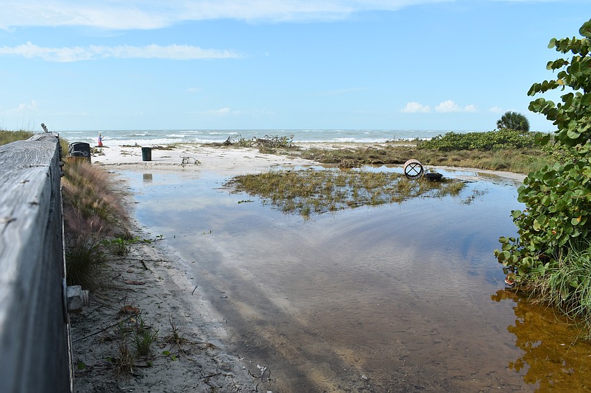 Beach erosion is shown at the public beach access point near 100 Broadway St.