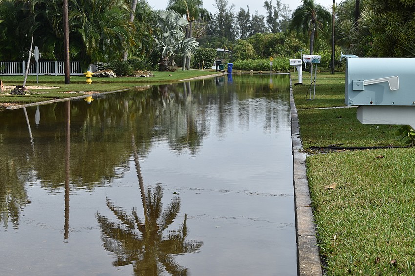 Russell Street in the Village neighborhood was filled with stormwater on Thursday morning.
