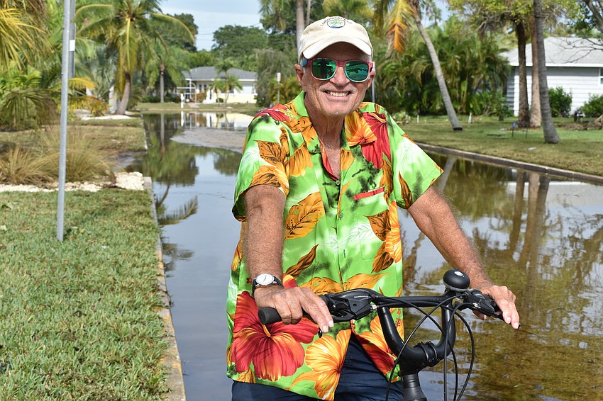 Fred Kagi rode his bike Thursday morning around the Longbeach Village neighborhood after Eta passed through the day before.