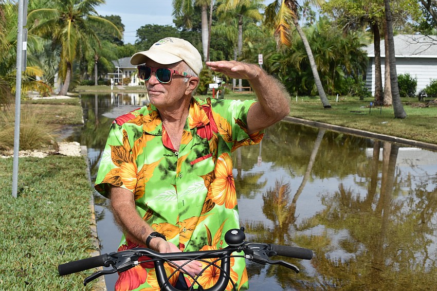 Fred Kagi rode his bike Thursday morning around the Longbeach Village neighborhood after Eta passed through the day before.