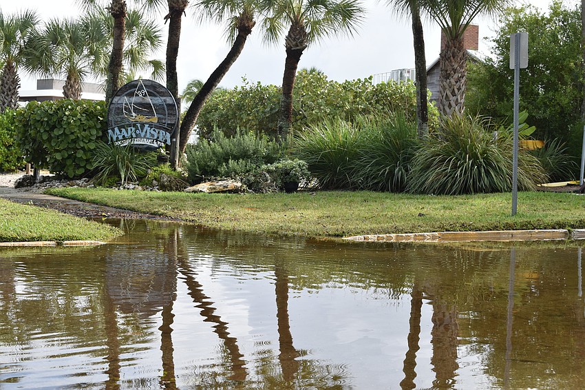 The stormwater is shown in front of Mar Vista Dockside Restaurant on Thursday morning.
