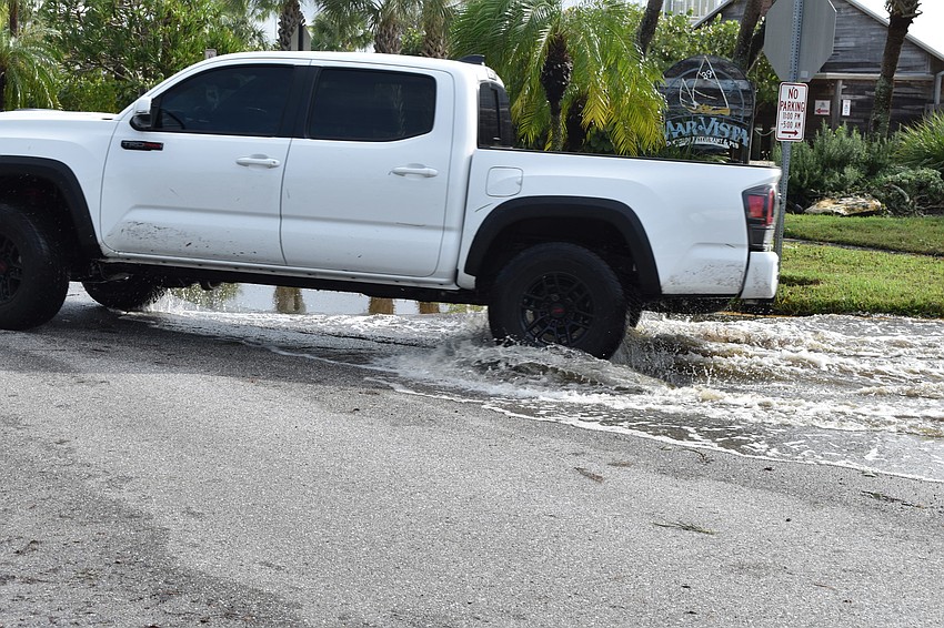 The stormwater is shown in front of Mar Vista Dockside Restaurant on Thursday morning.