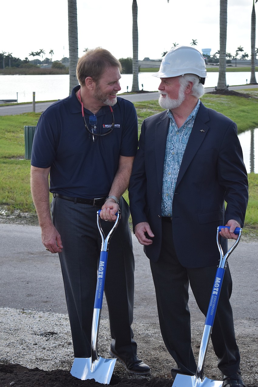 Willis Smith Construction Executive Vice President John LaCivita and Mote CEO and President Michael Crosby go over the finer points of operating a shovel.