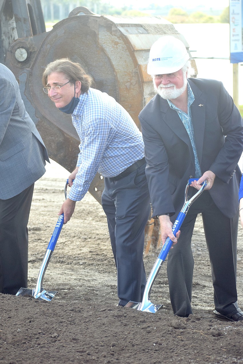 Randy Benderson joins Mote CEO and President Michael Crosby in a little ceremonial digging.