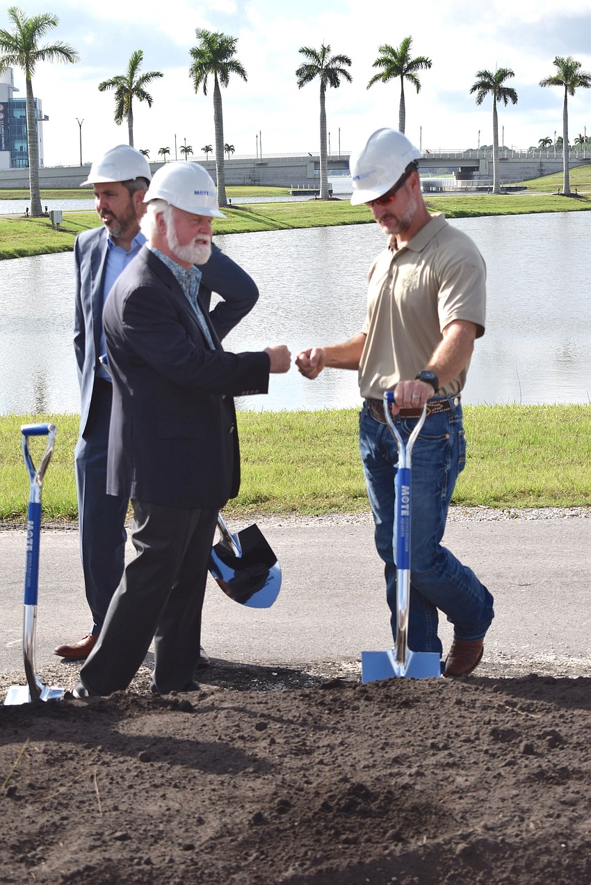 Mote CEO and President Michael Crosby gets an atta-boy fist bump from Congressman Greg Steube, R-17th district.