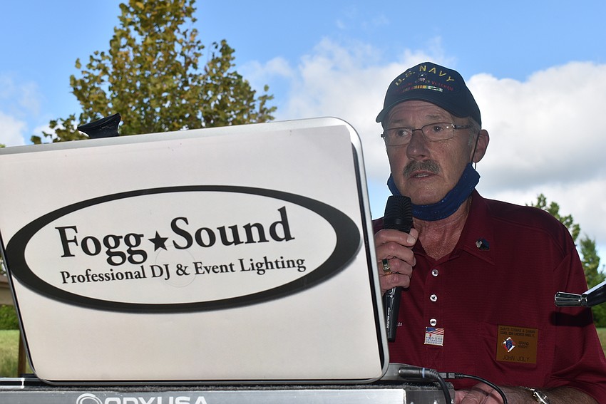 Knights of Columbus grand knight John Joly speaks to attendees of the Veterans Day parade. 