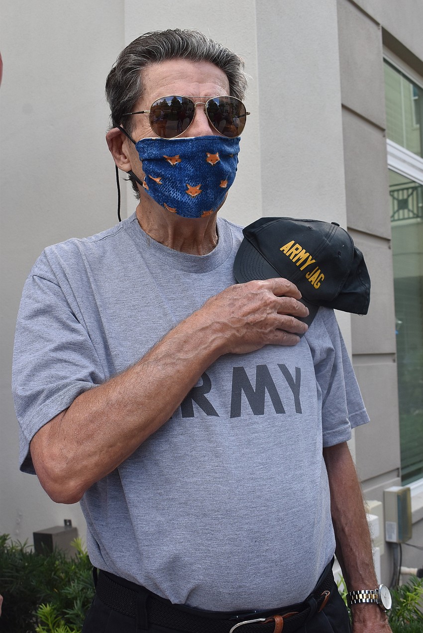 Four-year Army veteran Bill Kopcsak stands at attention for the playing of the Star-Spangled Banner.