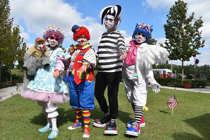 (From left) Toodles, Sparky, Tunes and Anita Smile are Tidewell Hospice Clowns. They were all excited to be working their first outing in six months.
