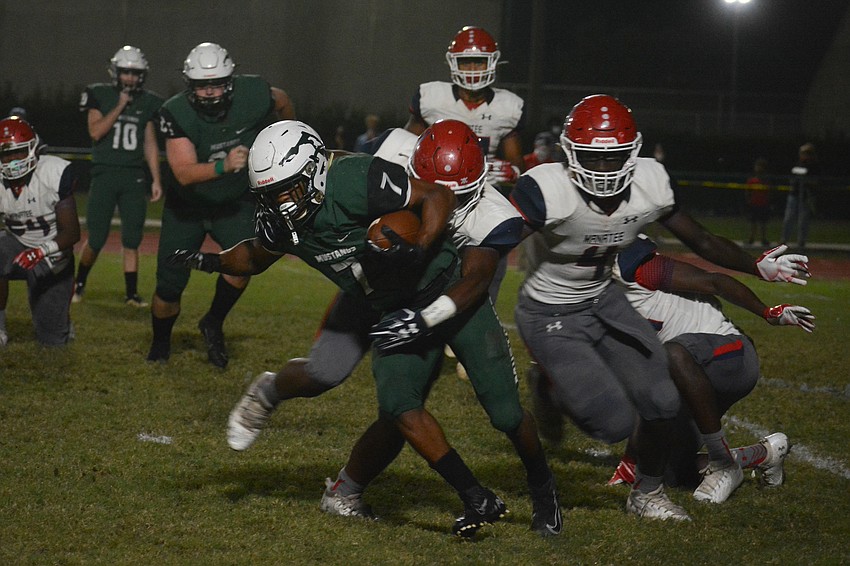 Lakewood Ranch running back Eli Daniels fights through the Manatee defense.