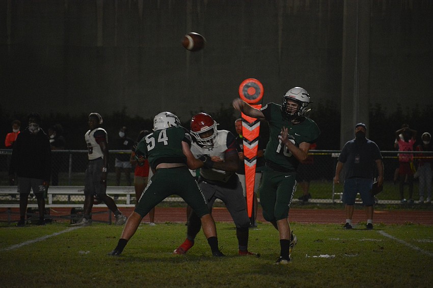 Lakewood Ranch senior quarterback Jimmy Kelly throws a pass to his left. Kelly would finish the game with one touchdown pass.
