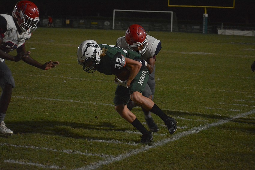 Lakewood Ranch junior wideout Kaden Allen fights for yardage along the sideline.