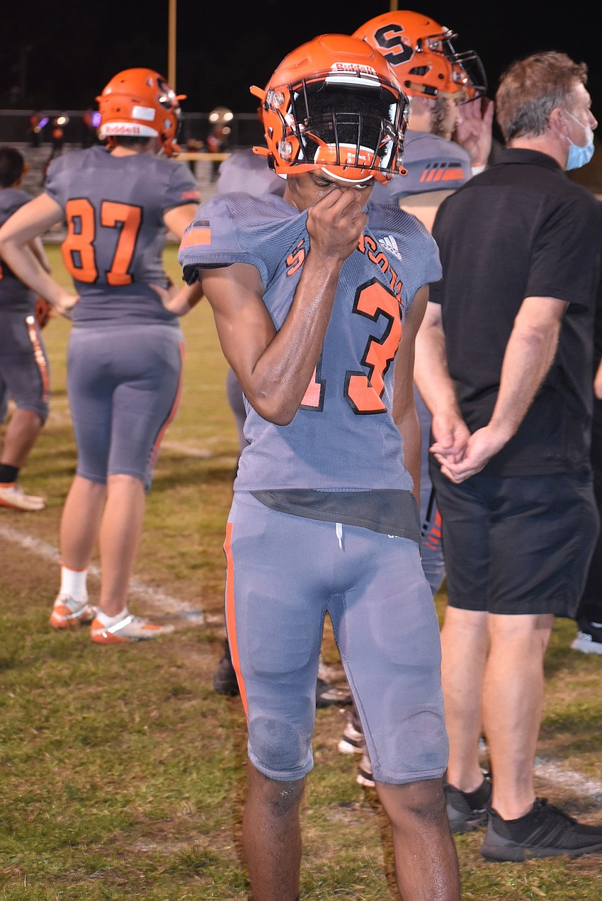 Sarasota sophomore Tyler Pack wipes the sweat off his face after the Sailors conceded a touchdown drive to fall behind 21-7 in the last two minutes of the first half.