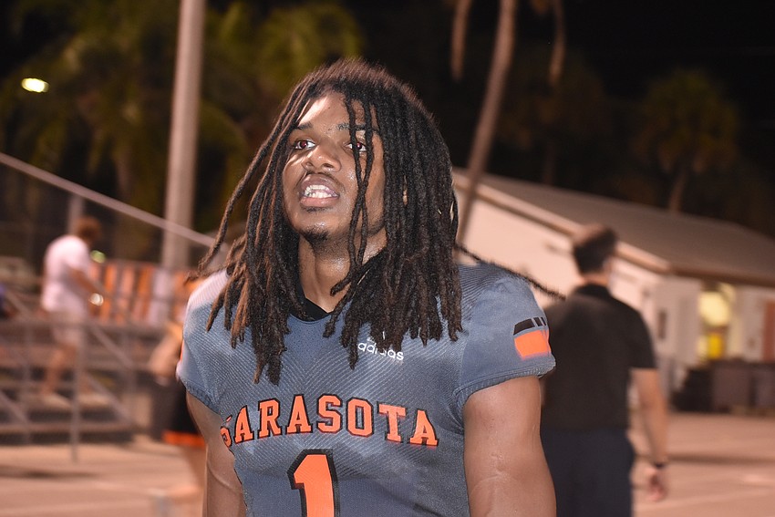 Sarasota senior Terrell Pack walks the Sailors' sideline after catching a 40-yard touchdown on the final play of the first half to cut Lehigh's lead to 21-14.