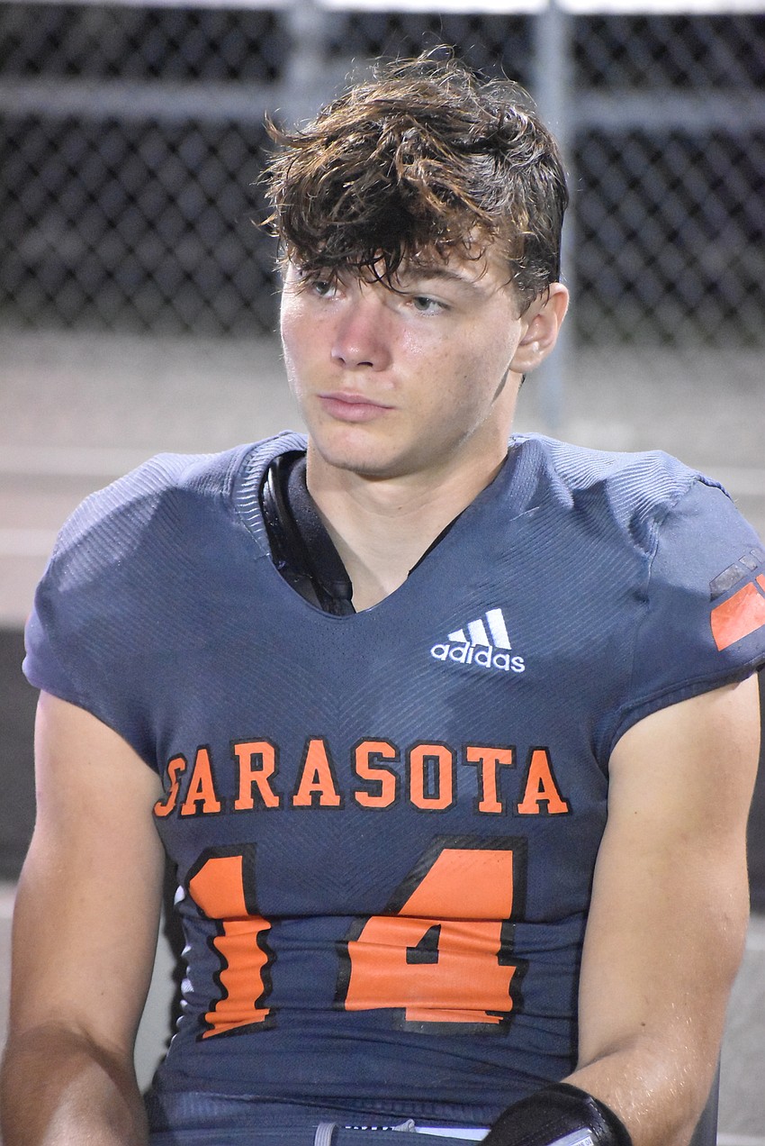 Sarasota junior Ashton Turner watches the Lehigh Lightning celebrate on the far sideline in the final moments of a 42-20 Sailors' loss.