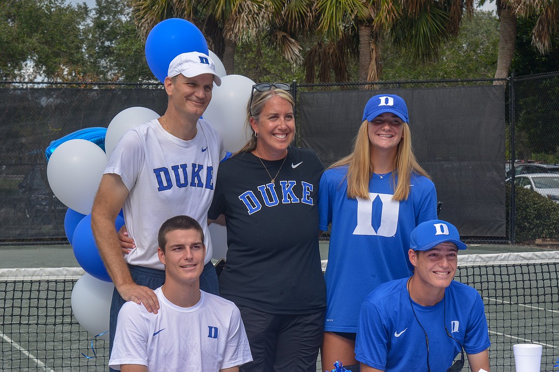Jake and Connor Krug, surrounded by parents Thomas Krug and Sherri Vitale Krug and sister Ava Krug, signed with Duke on Saturday.
