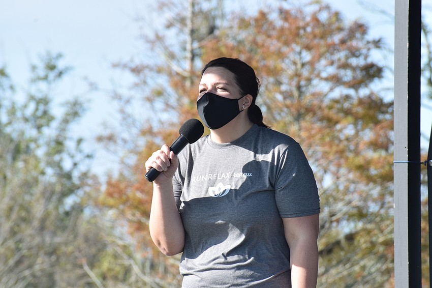 Monaca Onstad, the director of community relations for Lakewood Ranch Communities, welcomes about 60 people to the second annual Mindful Triathlon.