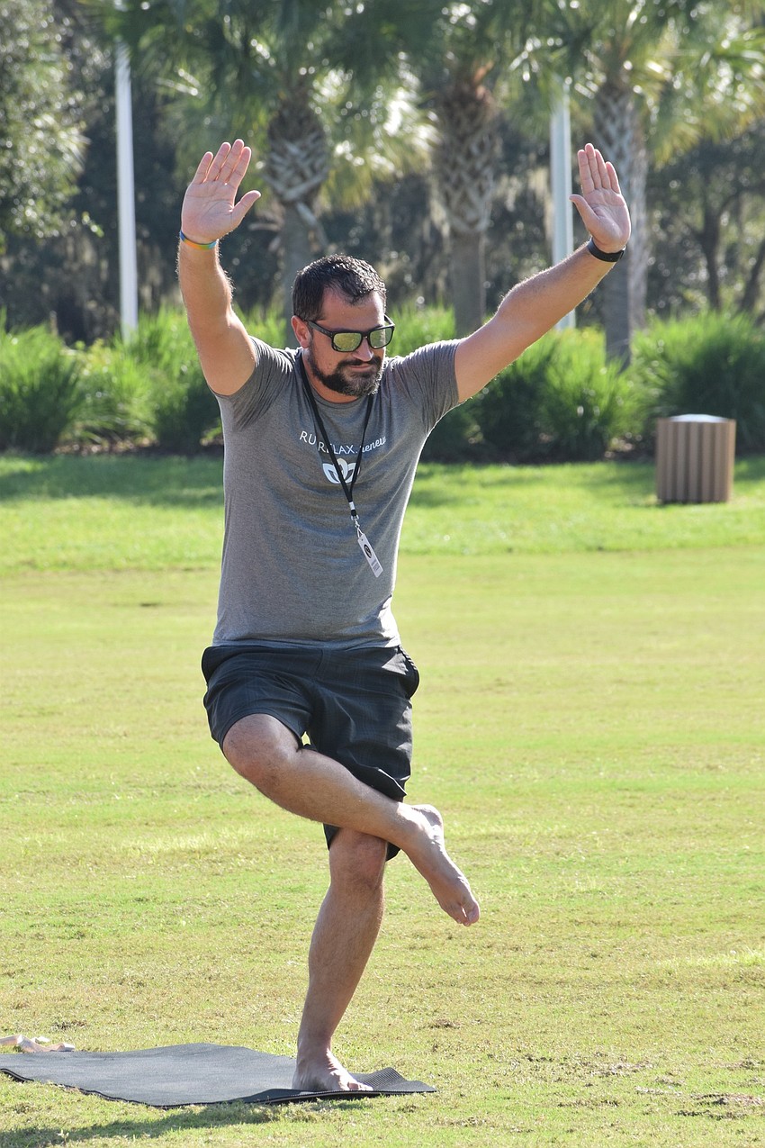 Keith Pandeloglou, the executive director of Lakewood Ranch Community Activities, finds his balance during yoga.