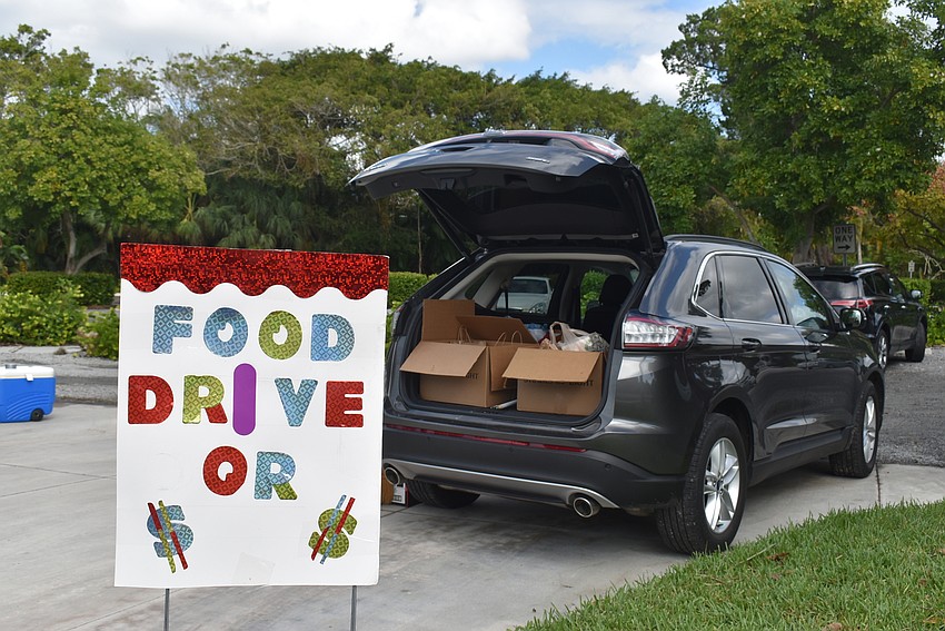 One car stood at the ready to collect more groceries.