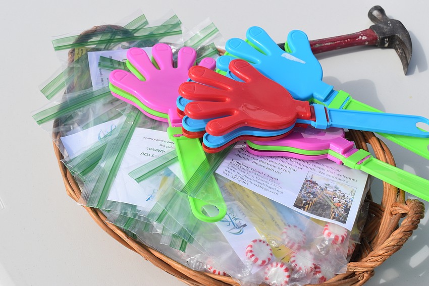 The group had noisemakers to get drivers' attention and thank-you bags for donors.