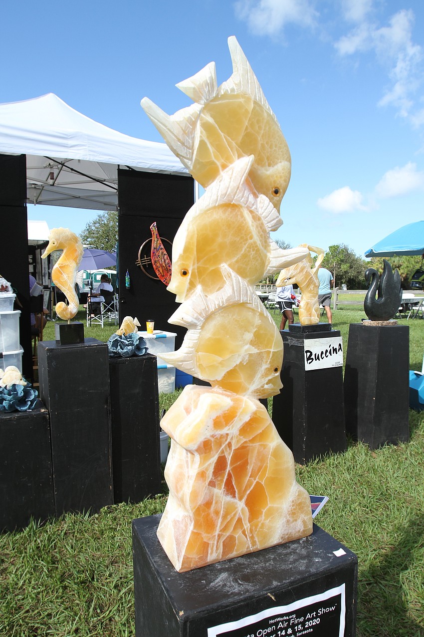 Scott Bucina had large, colorful stone sculptures for people to check out.