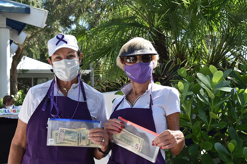 Bonnie Van Overbeke and Sandy Keir gathered money for the 50/50 helicopter ball drop.