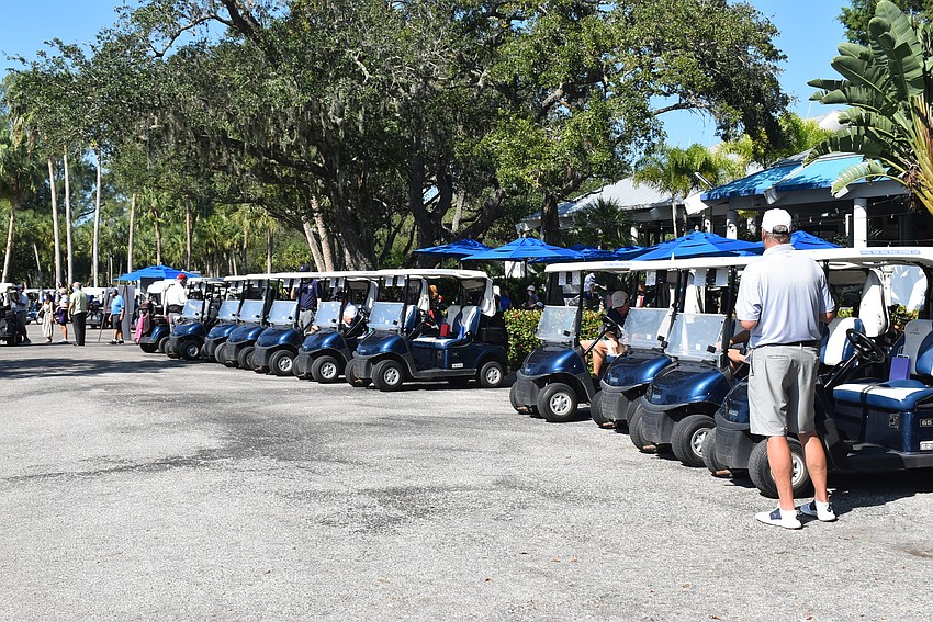 A small fleet of golf carts awaited the shotgun start.