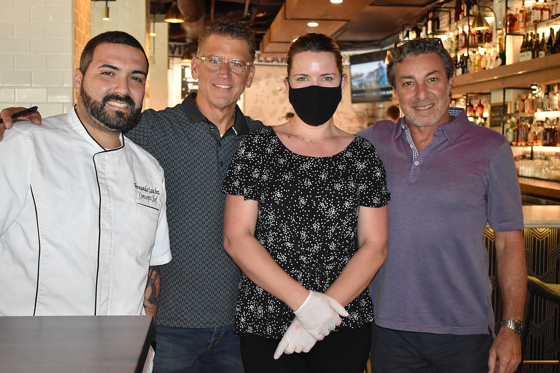 Concept chef Fernando Sanchez, partner Kevin Enderle, manager Meghan Croke and partner Raff Perna pose for a picture at ClÃ¡sico Italian Chophouse.