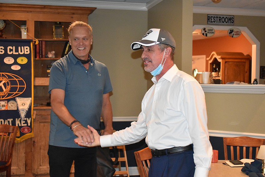 Chris Sachs presented Lazy Lobster owner Michael Garey with a Tampa Bay Lightning hat as a token of the club's gratitude.