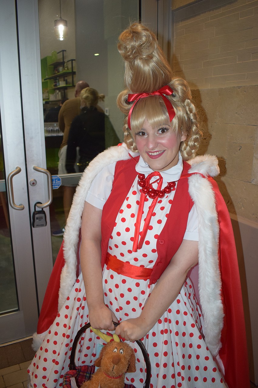 Morgany Knight of Legendary Knights Entertainment of Winter Haven, greeted guests outside Norman Love Confections.