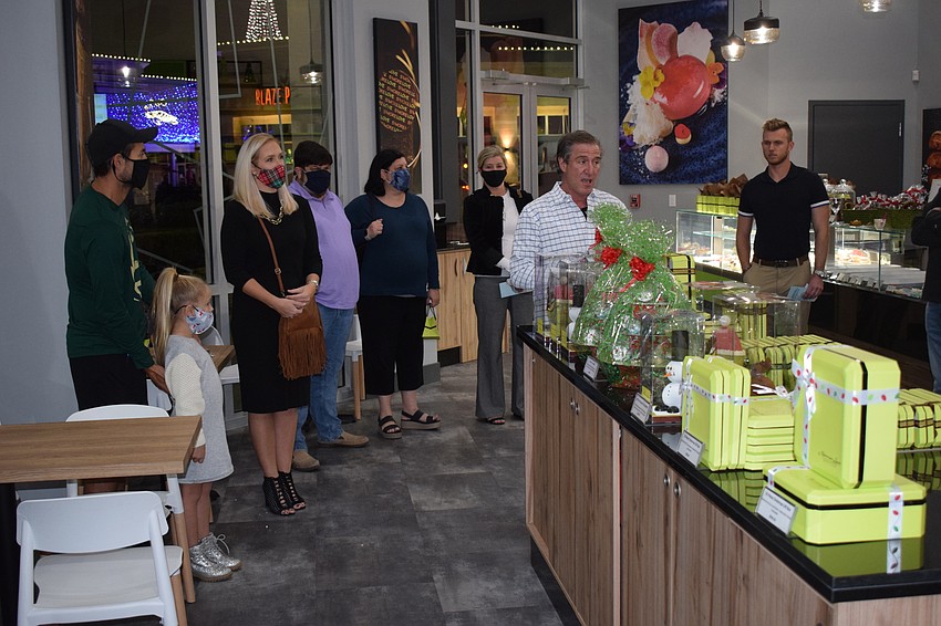 Norman Love addresses guests during his grand opening along with the holiday lights being switched on at the Mall at UTC.
