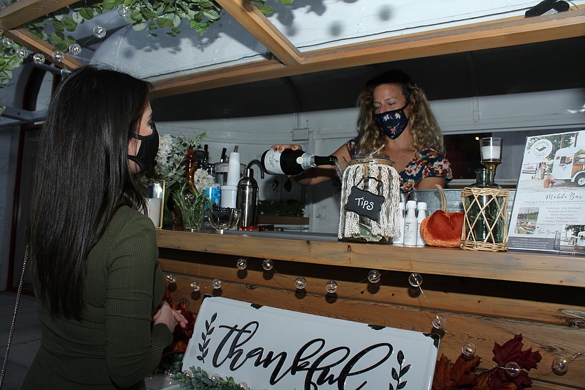 Guests picked up drinks at the Wandering Whale mobile bar.