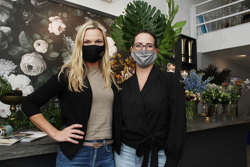 Event organizer Victoria Blooms and designer Erica Cary were smiling beneath the masks.