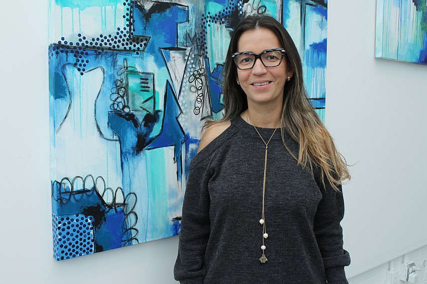 Artist Mara Torres showed attendees her artwork.