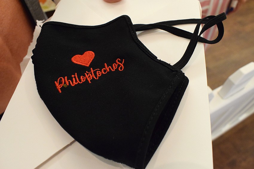 Volunteers and organizers of the Autumn Fall Fest are following social distancing guidelines and wearing masks to ensure people's safety during the event.