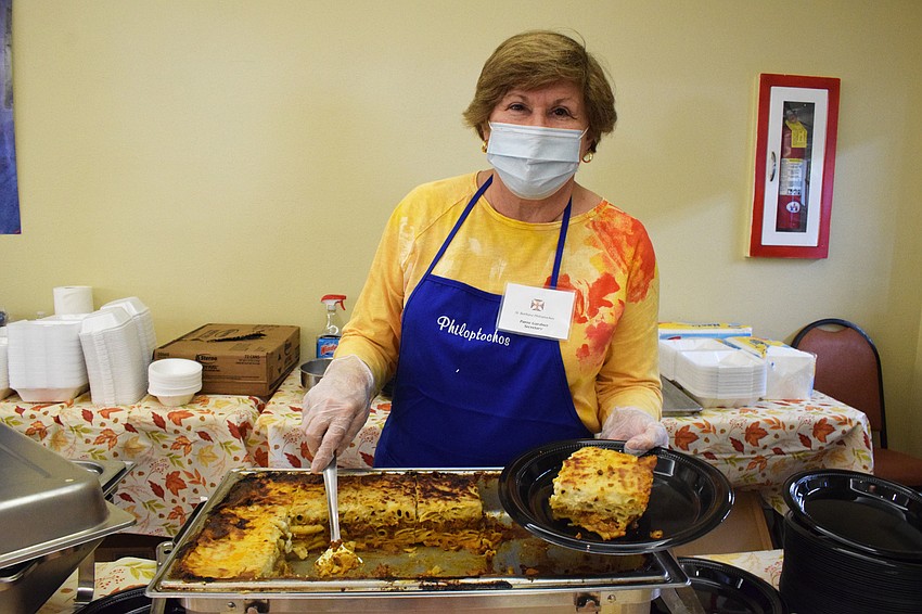 Country Club's Paree Gardner offers a serving of pastitsio, which is a Greek version of lasagna, but her favorite dish is the roasted lamb shanks.