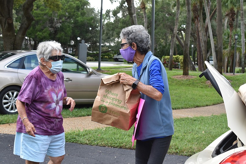 Debby Hamburg offers to help, but Max Spitzer unloaded her donations quickly.