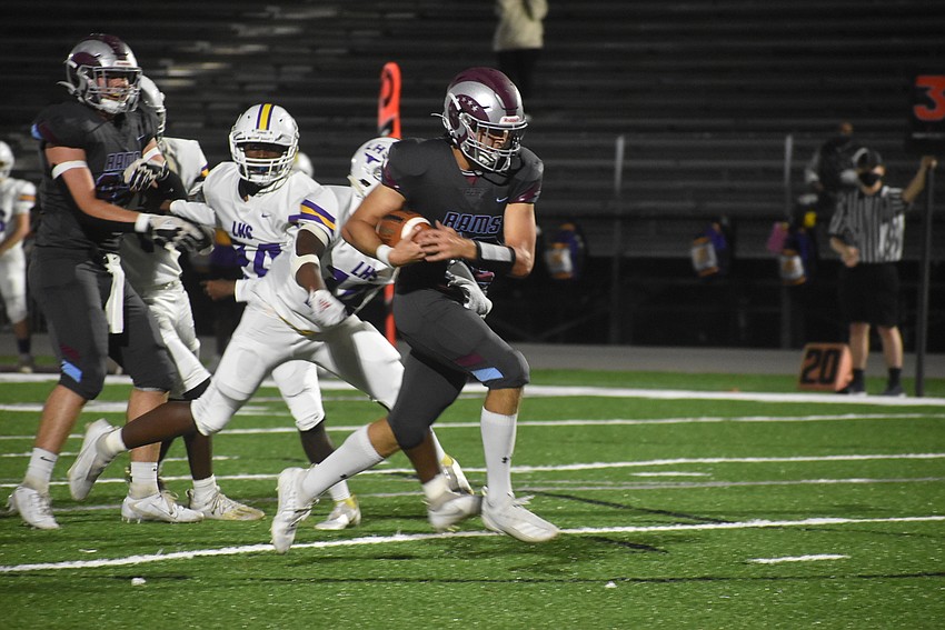 Riverview quarterback Will Evans rumbles into the end zone to give the Rams a 7-0 lead.