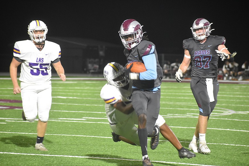 Riverview junior Duke Timmons fights for yardage on a wide receiver screen late in the second quarter. The Rams would soon score a touchdown to extend their lead to 13-0.