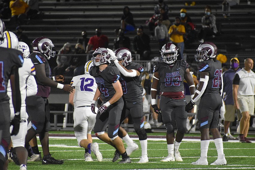 Riverview senior Daevon Lebron congratulates senior Kyle Coggin after the latter recorded a sack late in the first half.