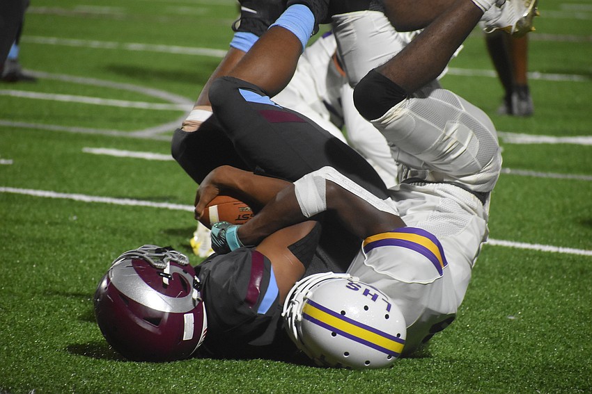 Riverview running back Jay'den Birch is tackled at the 1-yard line by Lennard senior Darius Frazier in the third quarter. Birch punched the ball in on the next play to extend Riverview's lead to 27-0.