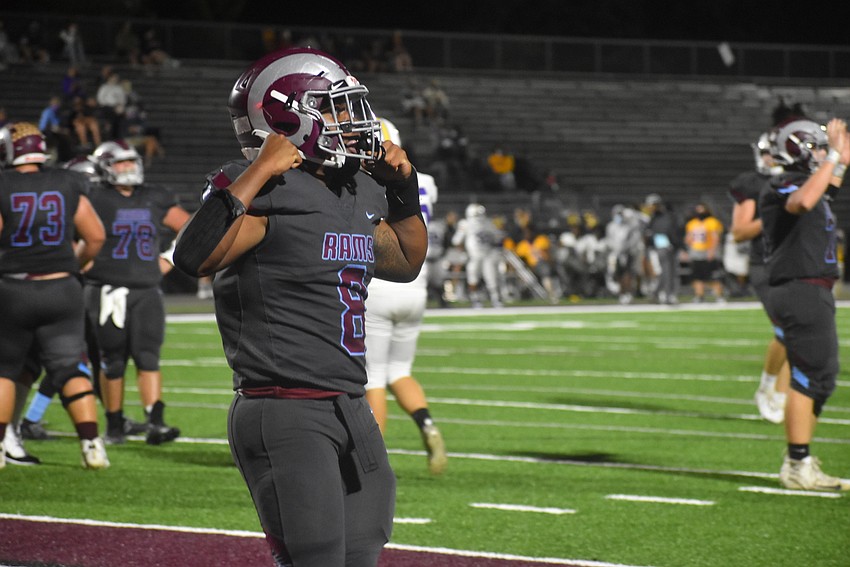 Riverview running back Jay'den Birch flexes after running over a Lennard defender for a 1-yard touchdown run to extend the Rams' lead to 27-0.