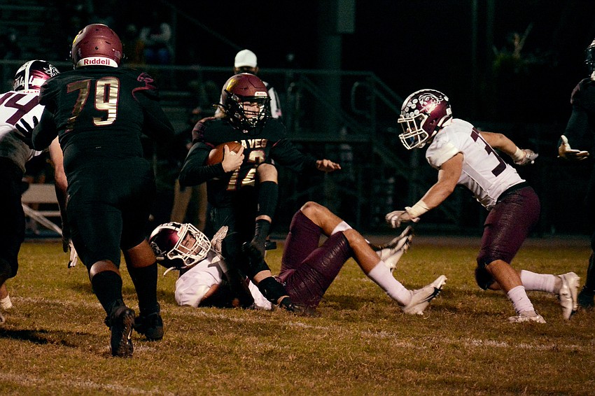Sophomore linebacker Tanner Wolfe sacks Lake Gibson quarterback Logan Hackett.