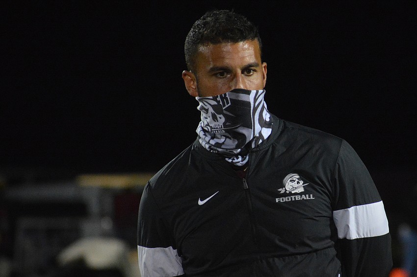Curt Bradley talks to his team after the 56-49 loss.