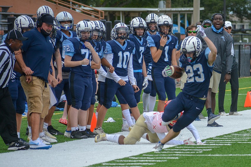 ODA running back Grady Paxton tiptoes the sideline.