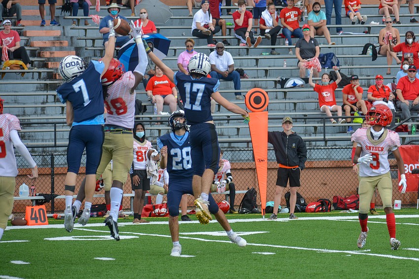 Tyler Coppins (7) and Connor Pope (17) break up a Bishop Snyder pass.