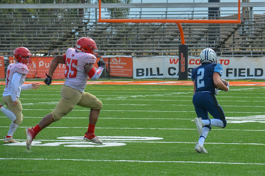 ODA's Ashton Lamb (2) cuts upfield on a toss play.