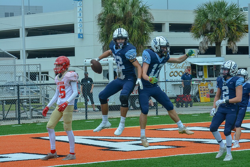 Nolan Lewellen and Connor Pope celebrate Lewellen's touchdown.