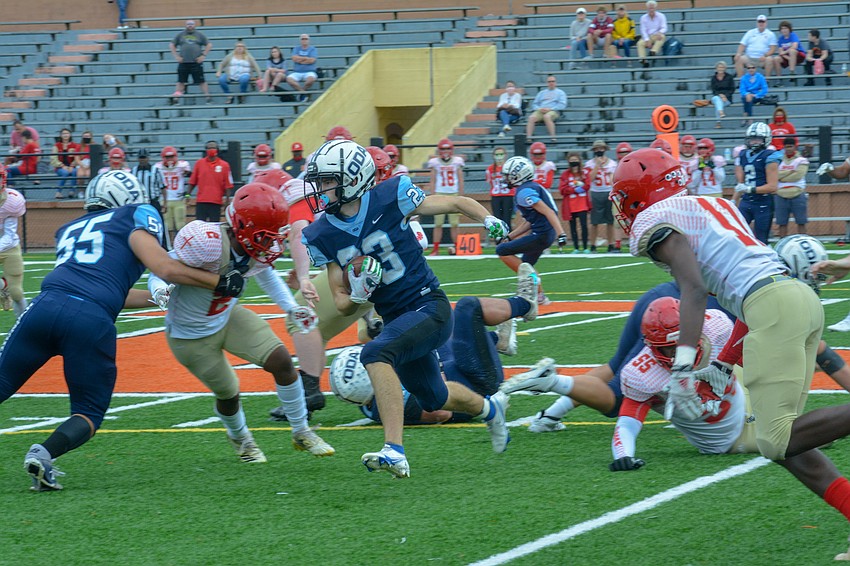Grady Paxton runs through the Bishop Snyder defense.