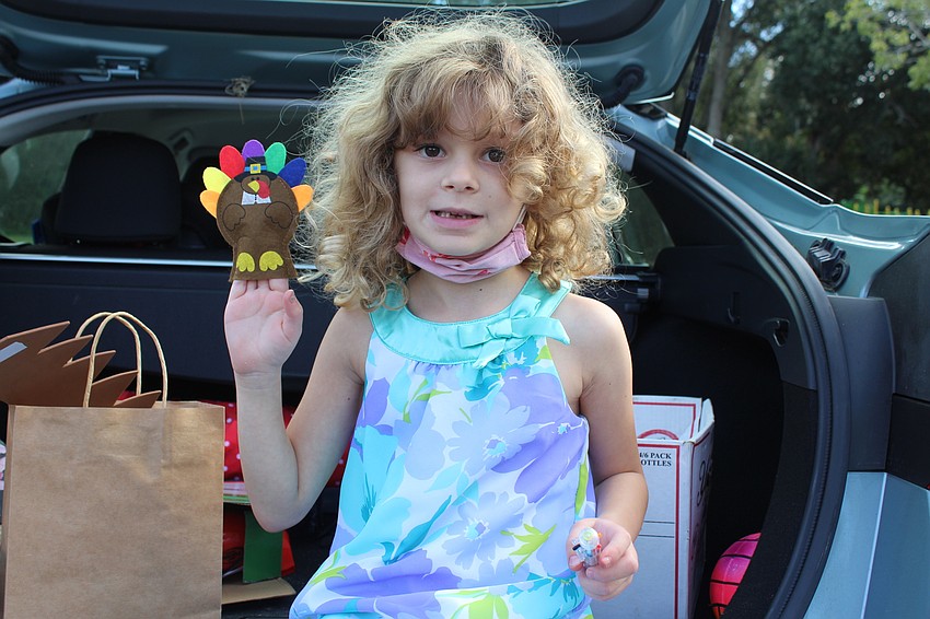 Samaya Laeger enjoyed her turkey finger puppet.