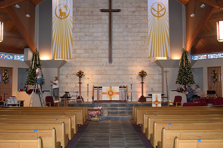 The altar is flanked by two trees.